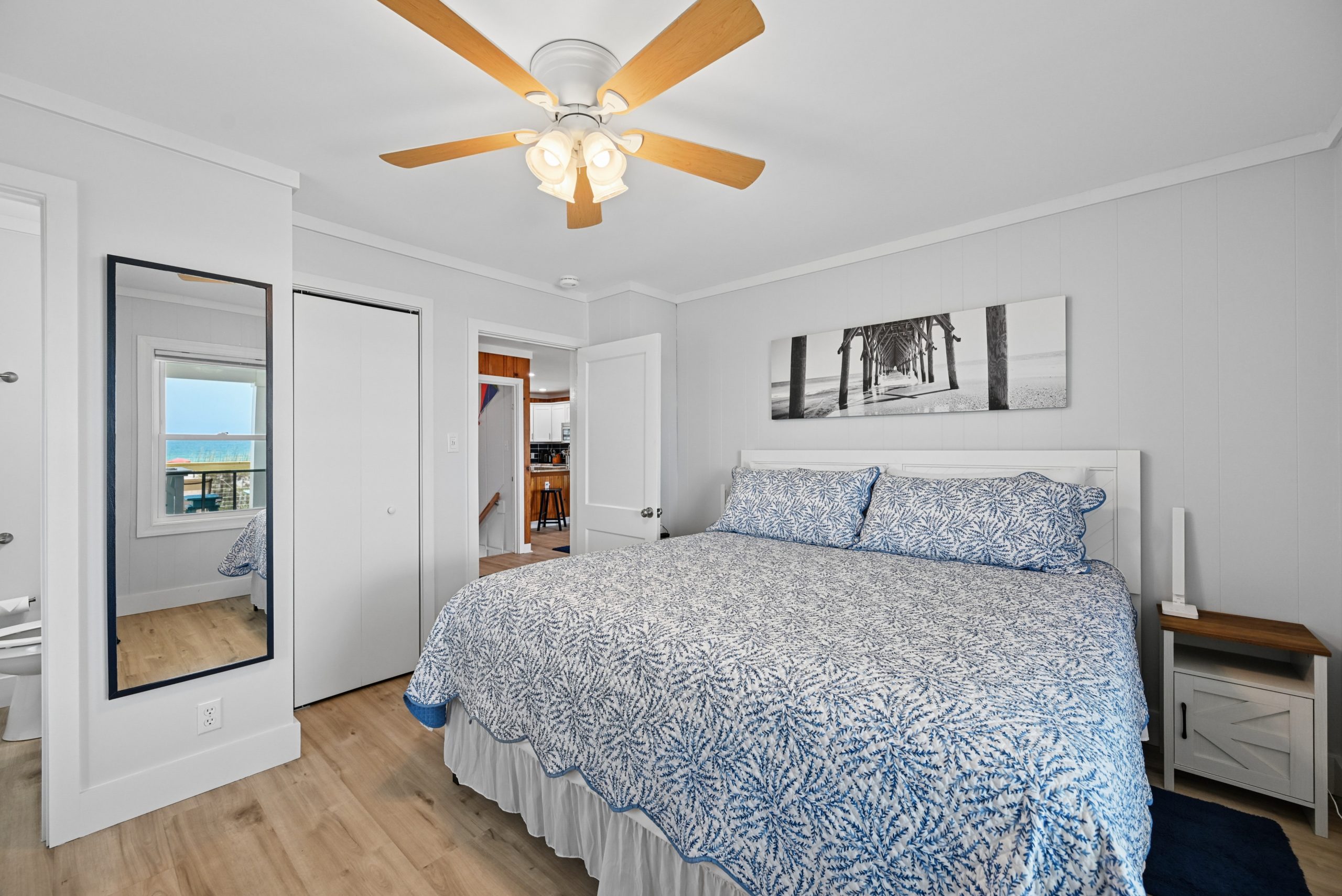 Main floor master bedroom with king bed and half bath