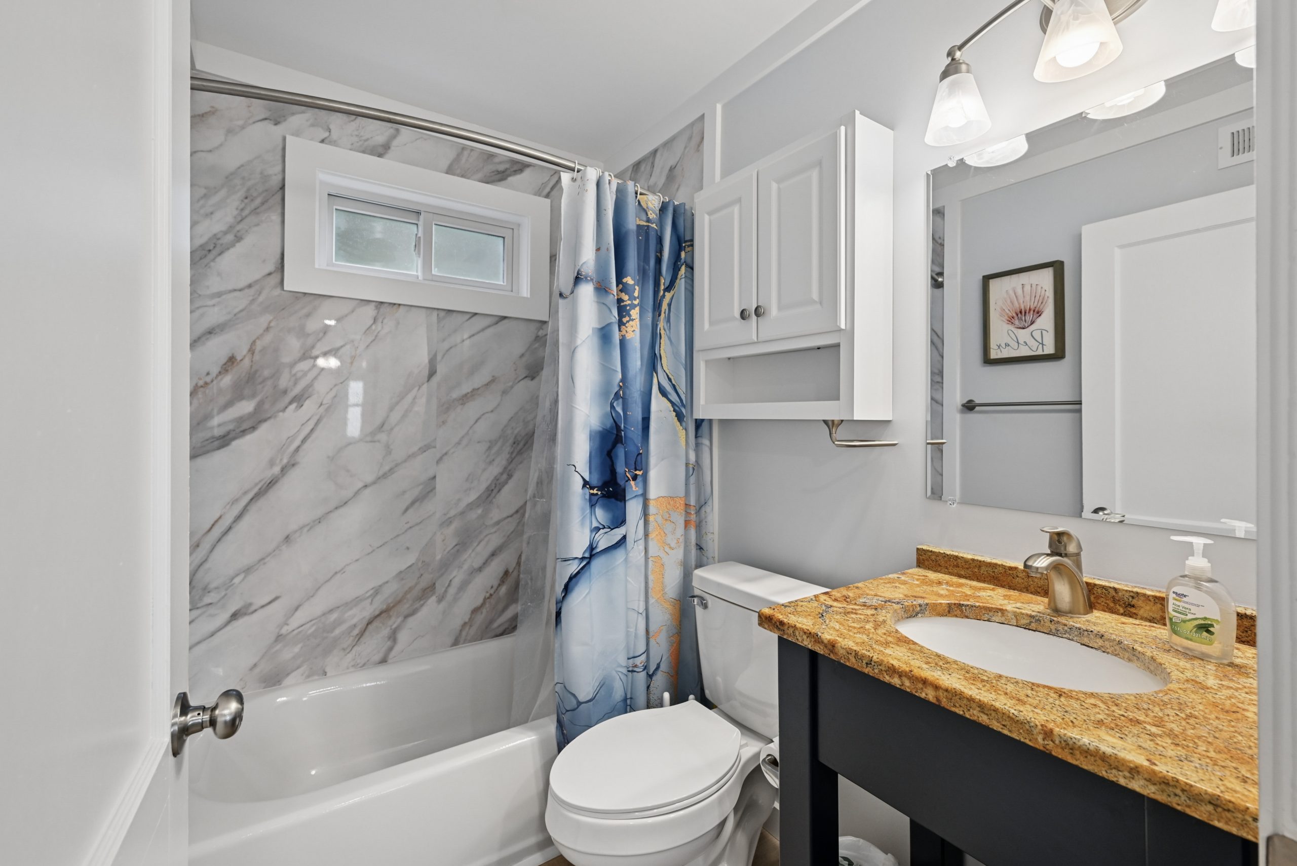 Full bathroom with tub and shower on the ground floor