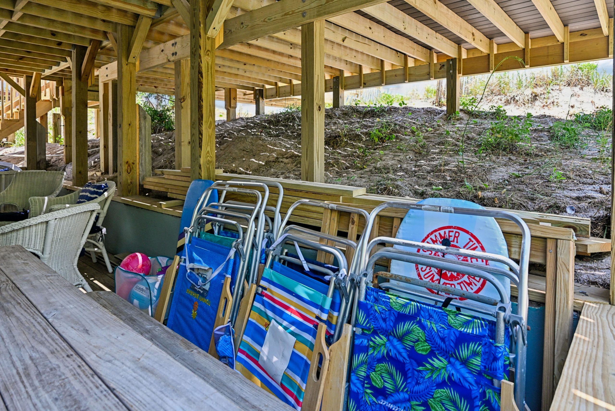 Chairs, boogie boards and sand toys for your convenience